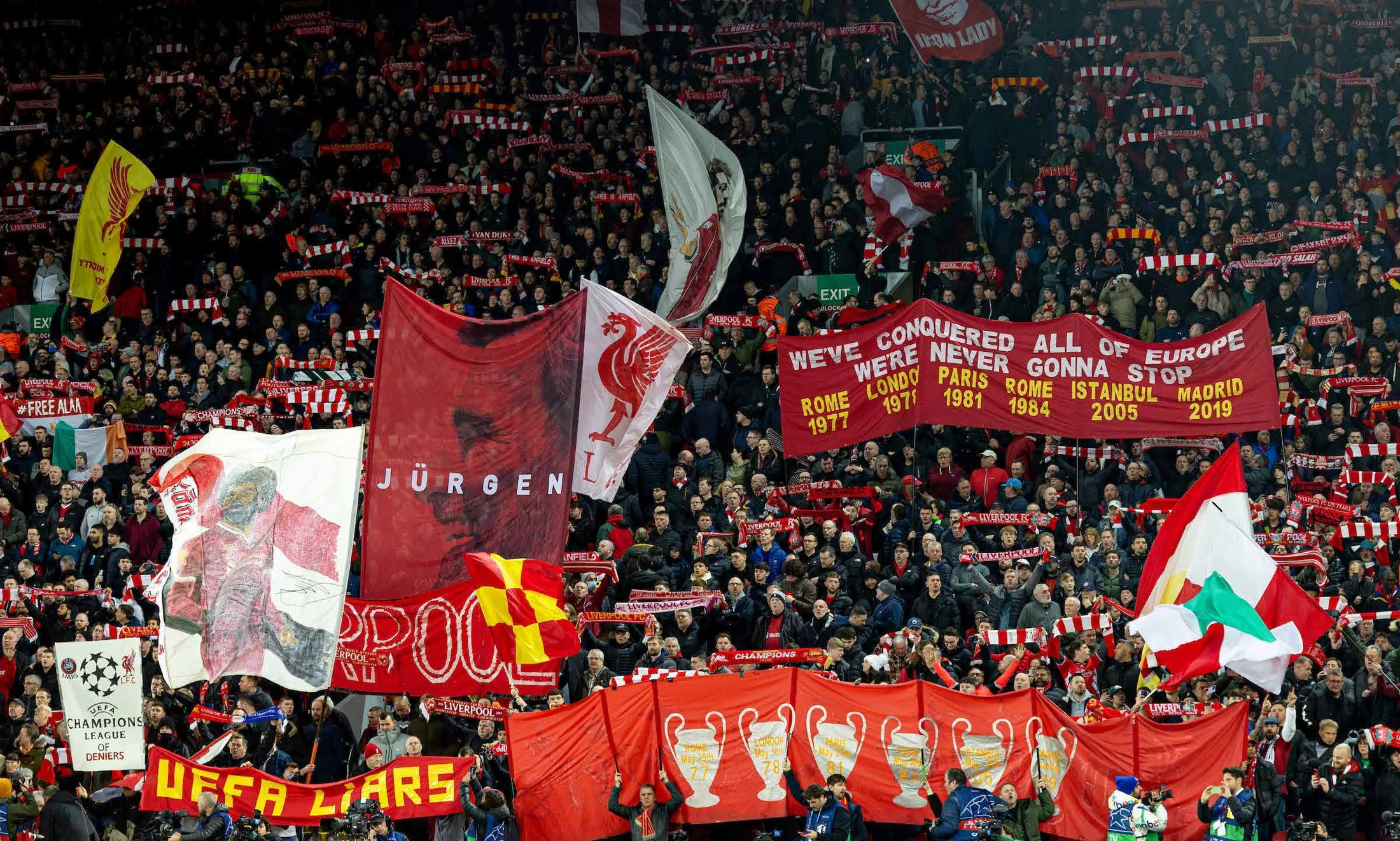 Liverpool supporters fill the Kop with flags and banners